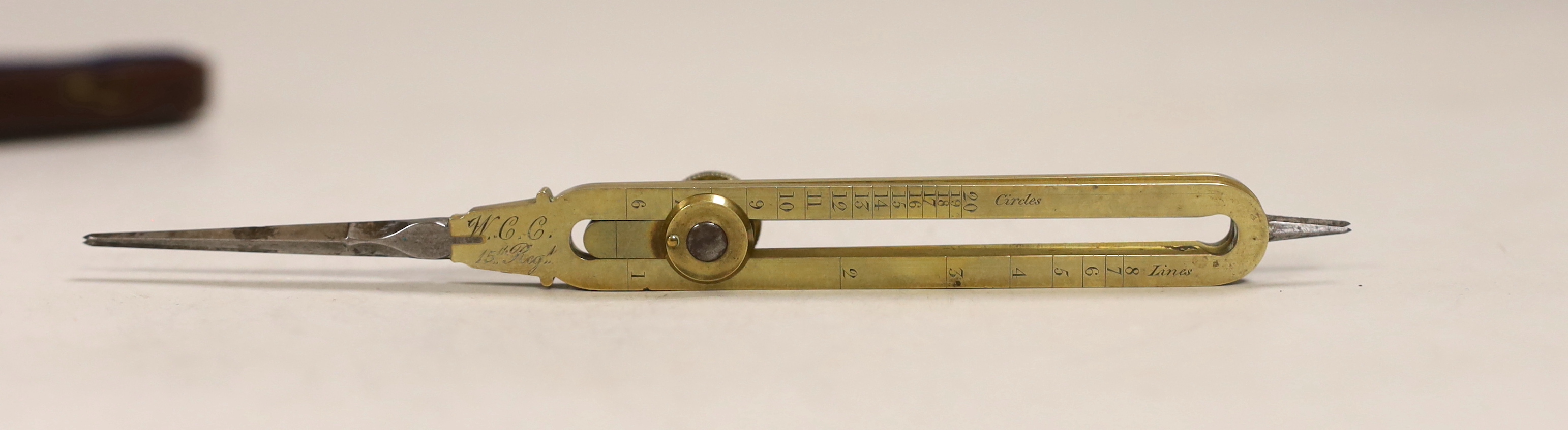 A 19th century brass and steel proportional compasses, Elliott Bros., 30 The Strand, engraved WCC, 15th Regt (East Yorks Regiment), in morocco case